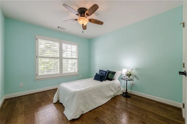 a view of an empty room with a ceiling fan