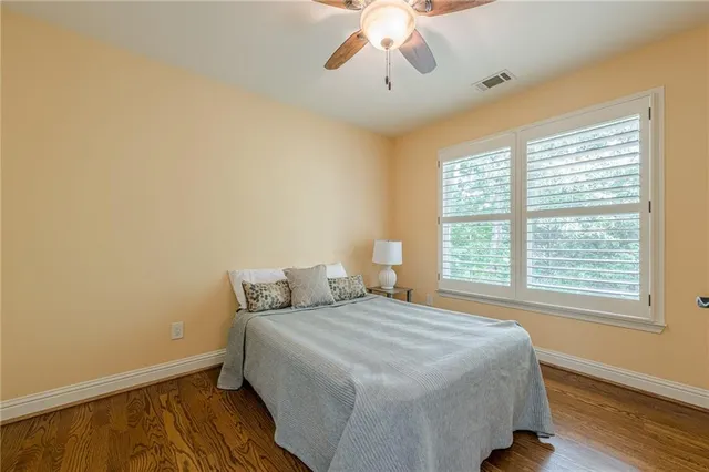 a view of an empty room with a ceiling fan