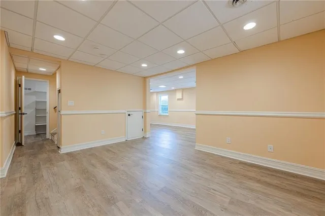 a view of a house with a yard and sitting area