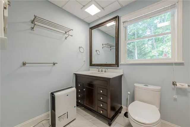 an aerial view of a house with a yard basket ball court and outdoor seating
