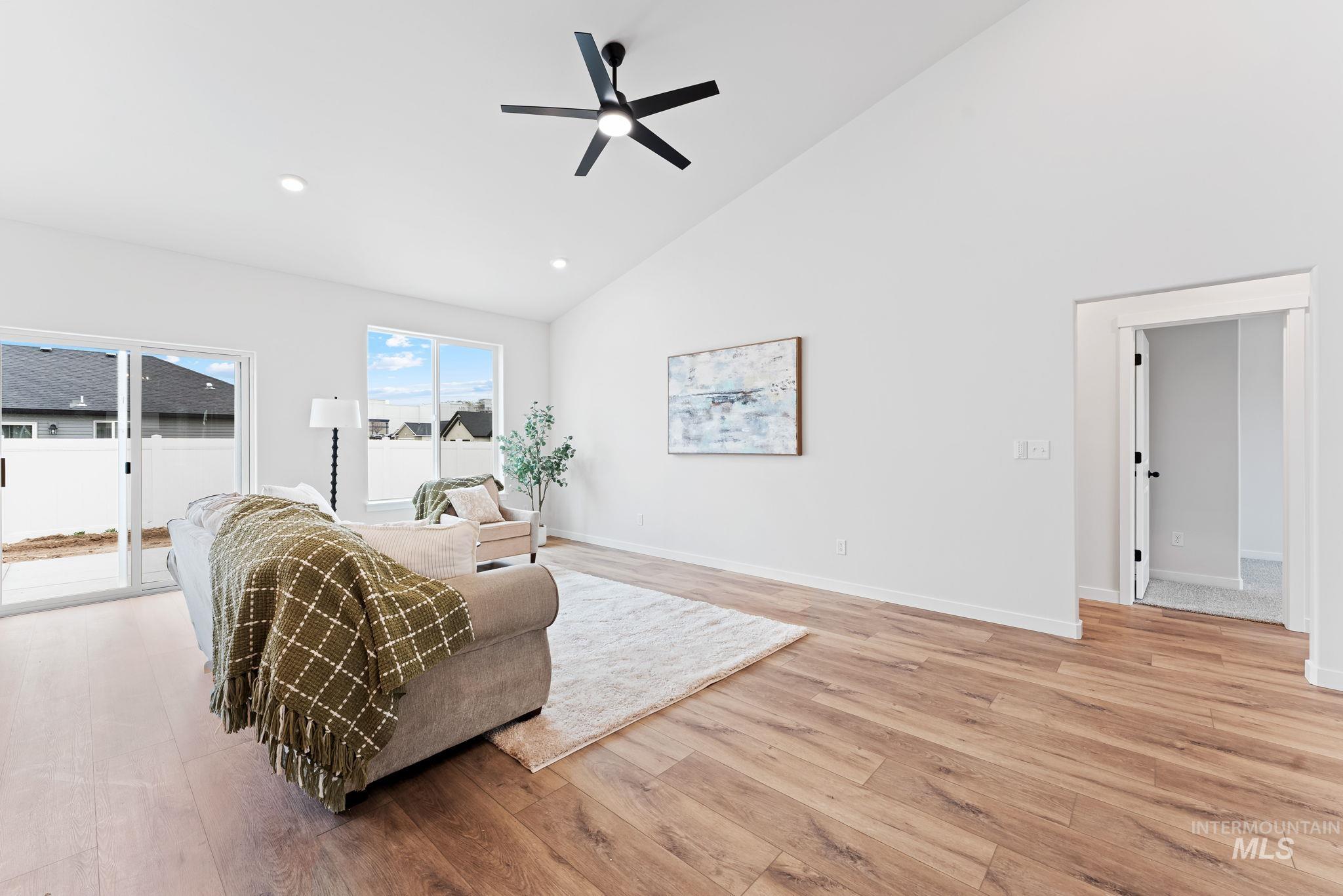 2220 Great Basin Way Burley, ID 83318 - Photo 8 of 39 Living room featuring light wood-style floors, ceiling fan, lofted ceiling, and recessed lighting