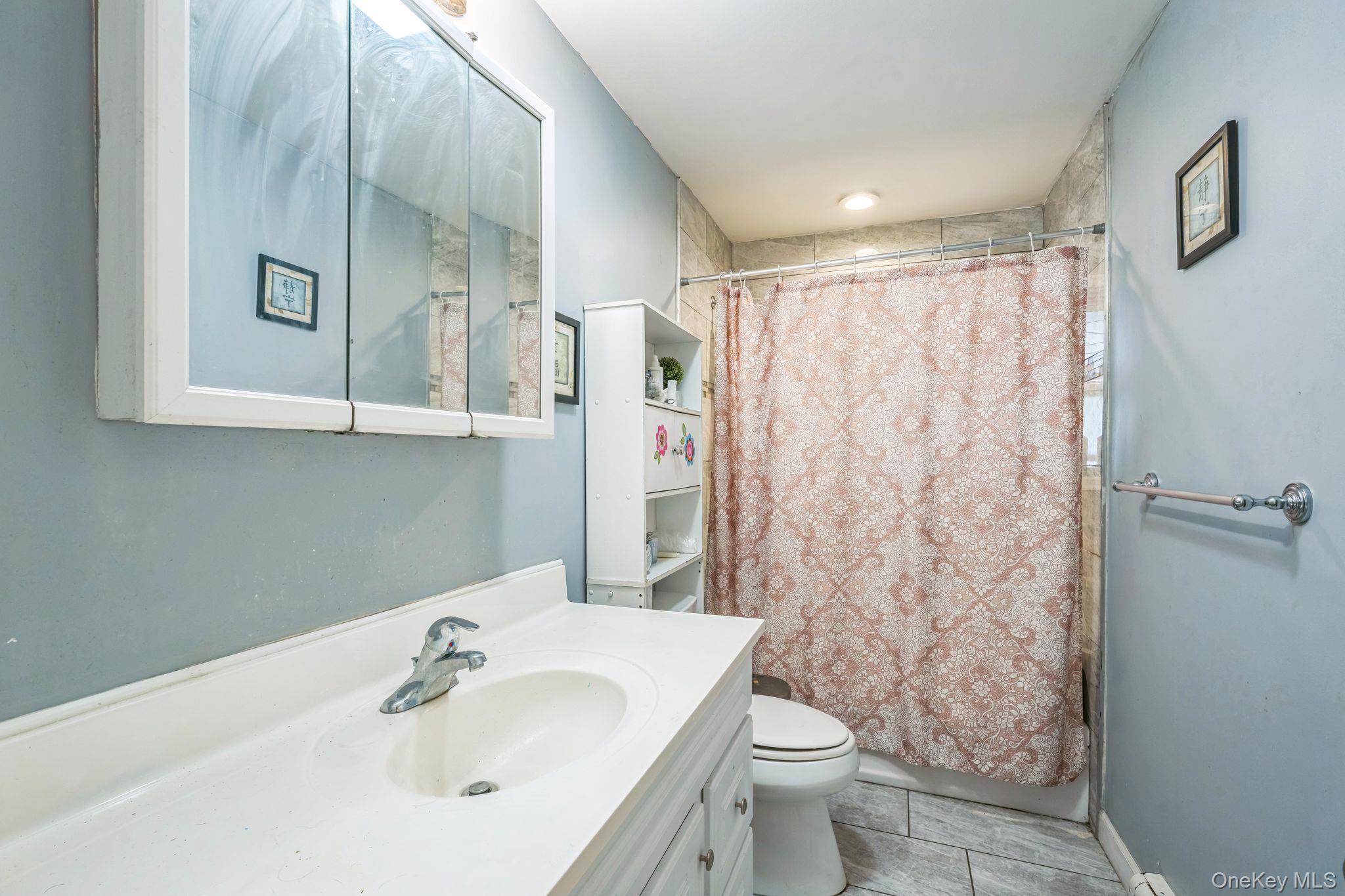 39 Willow Road Rocky Point, NY 11778 - Photo 15 of 18 Full bathroom featuring vanity and shower / tub combo