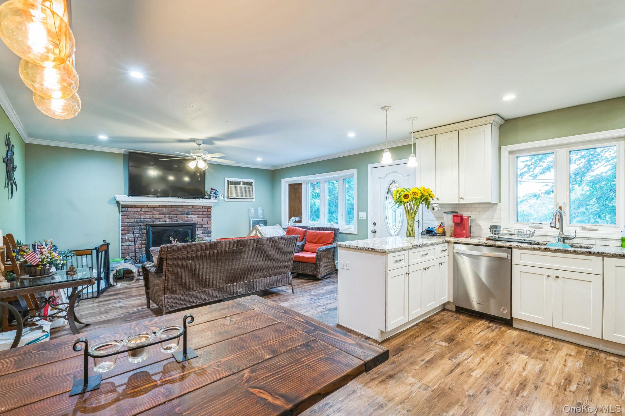 39 Willow Road Rocky Point, NY 11778 - Photo 17 of 18 Kitchen featuring a peninsula, light wood finished floors, dishwasher, recessed lighting, and open floor plan