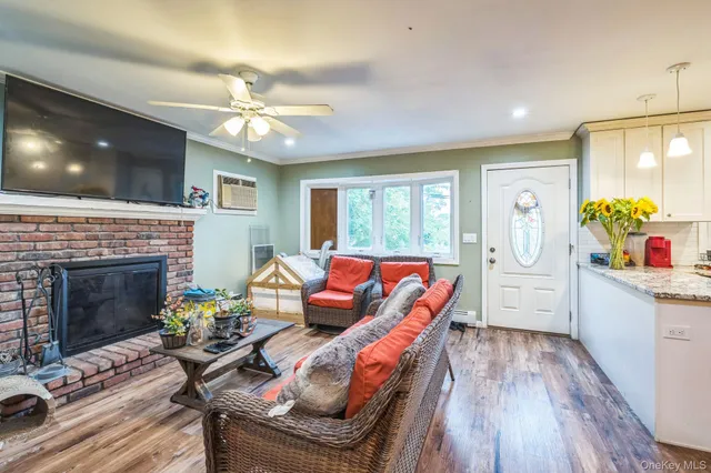 a kitchen with furniture a stove and white cabinets