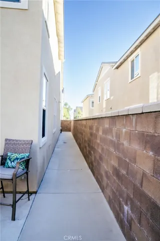 a living room with couches a coffee table and next to a window