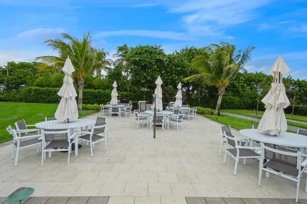 a view of a tables and chairs in patio