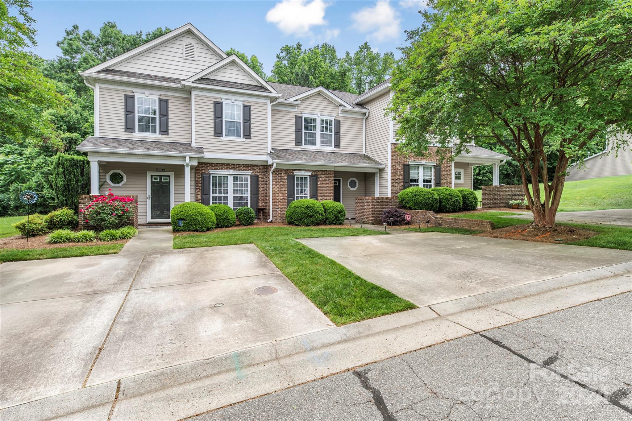 5810 Fox Ridge Lane Winston-Salem, NC 27104 - Photo 2 of 30 a front view of a house with a garden