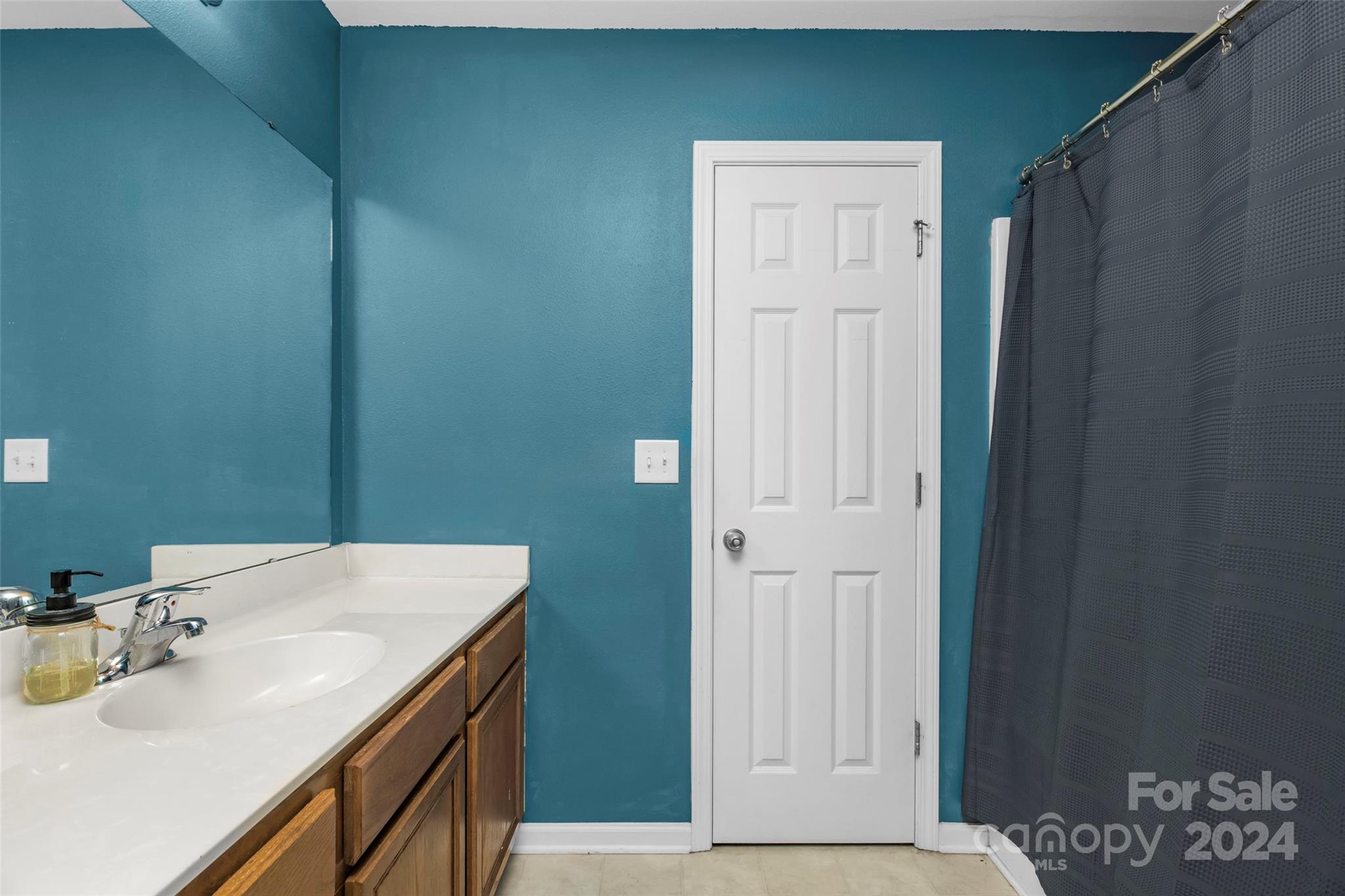 5810 Fox Ridge Lane Winston-Salem, NC 27104 - Photo 21 of 30 a bathroom with a sink and a mirror