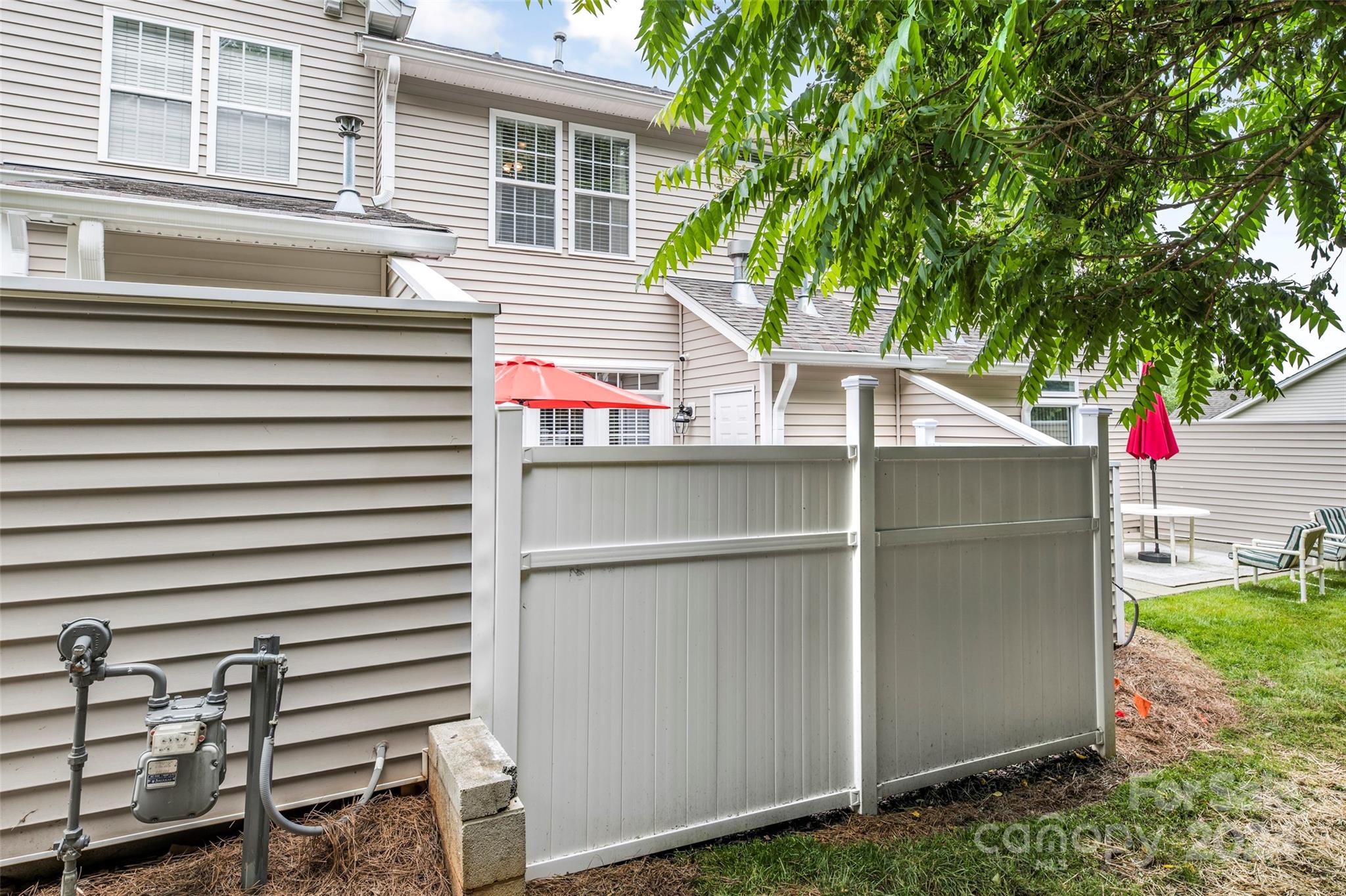 5810 Fox Ridge Lane Winston-Salem, NC 27104 - Photo 29 of 30 a backyard of a house with an outdoor space and seating