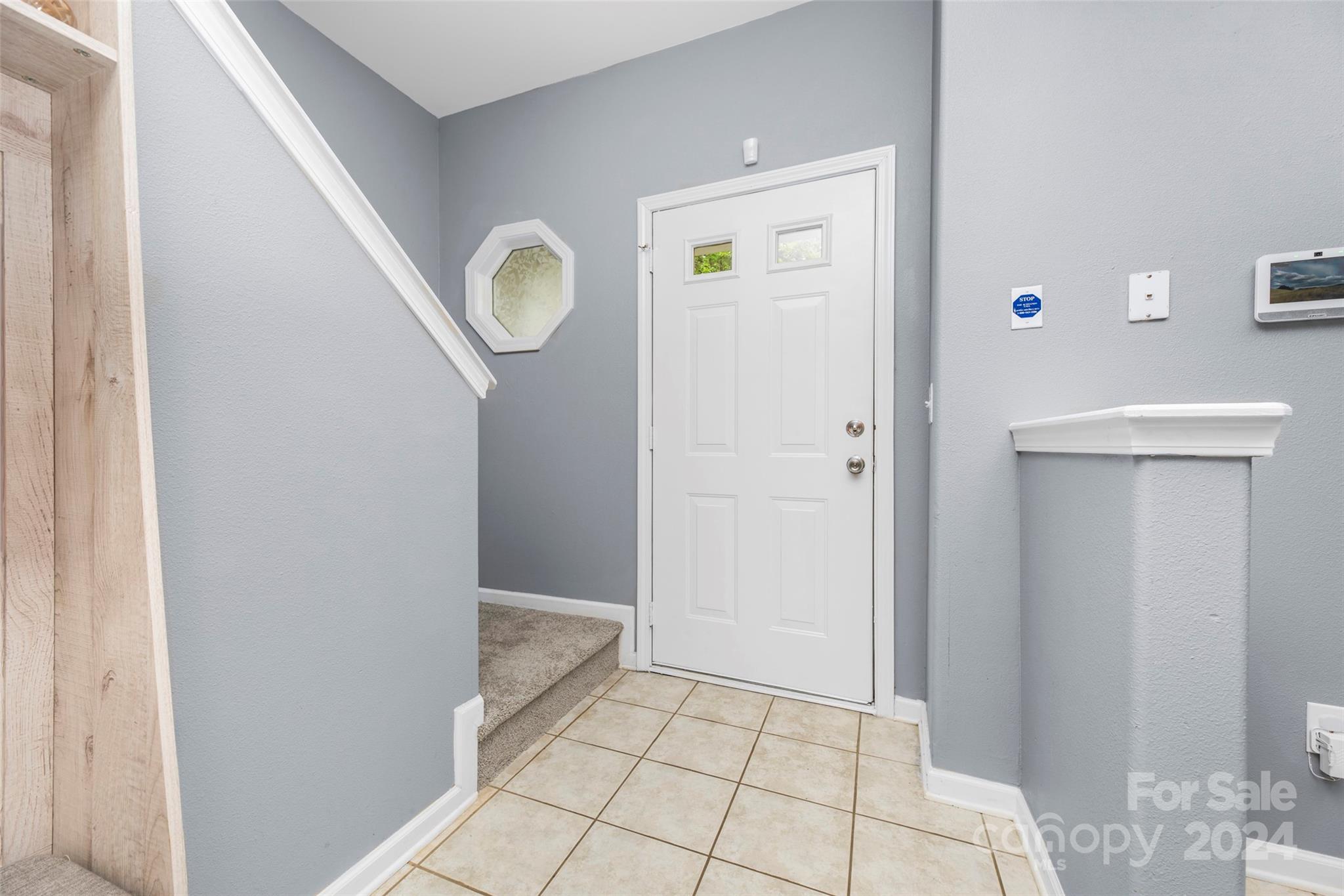 5810 Fox Ridge Lane Winston-Salem, NC 27104 - Photo 4 of 30 a view of an empty room with wooden floor