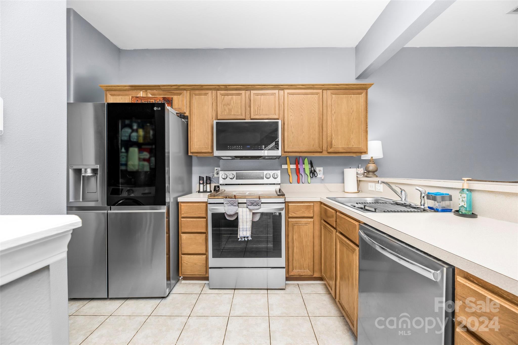5810 Fox Ridge Lane Winston-Salem, NC 27104 - Photo 5 of 30 a kitchen with a sink cabinets and stainless steel appliances