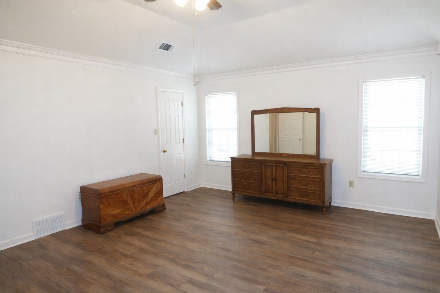 6708 Dawnhill Road Bartlett, TN 38135 - Photo 11 of 18 Spacious room featuring wood-finish flooring, white walls, and a white ceiling with a ceiling fan