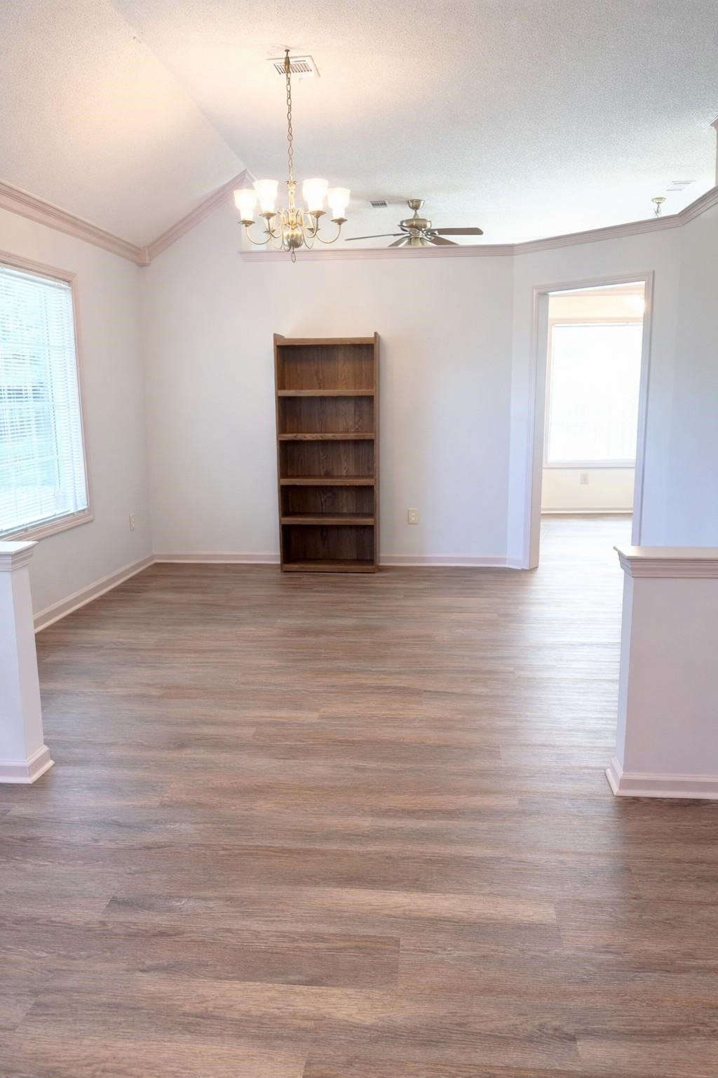 6708 Dawnhill Road Bartlett, TN 38135 - Photo 6 of 18 Expansive interior with wood-finish flooring, vaulted ceiling, and crown molding