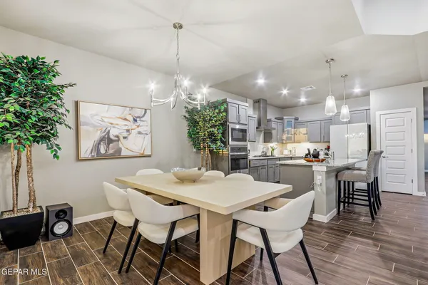 a kitchen with a table and chairs in it