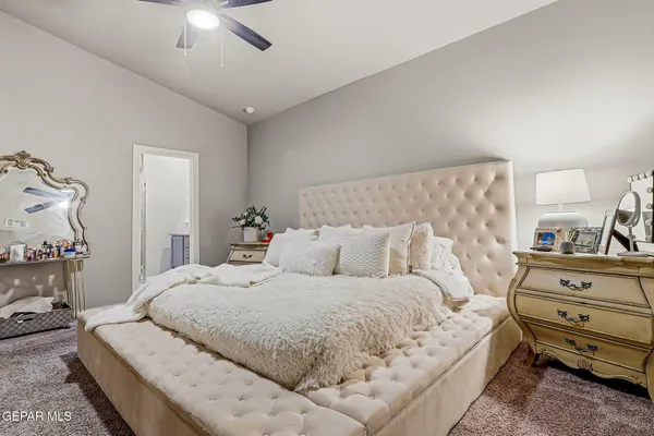 a bedroom with a bed and a dresser