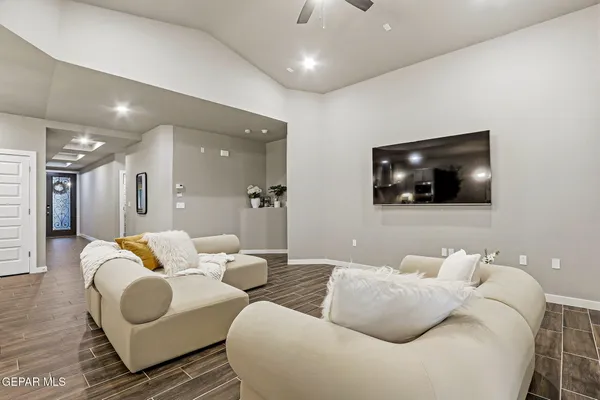 a living room with furniture and a flat screen tv