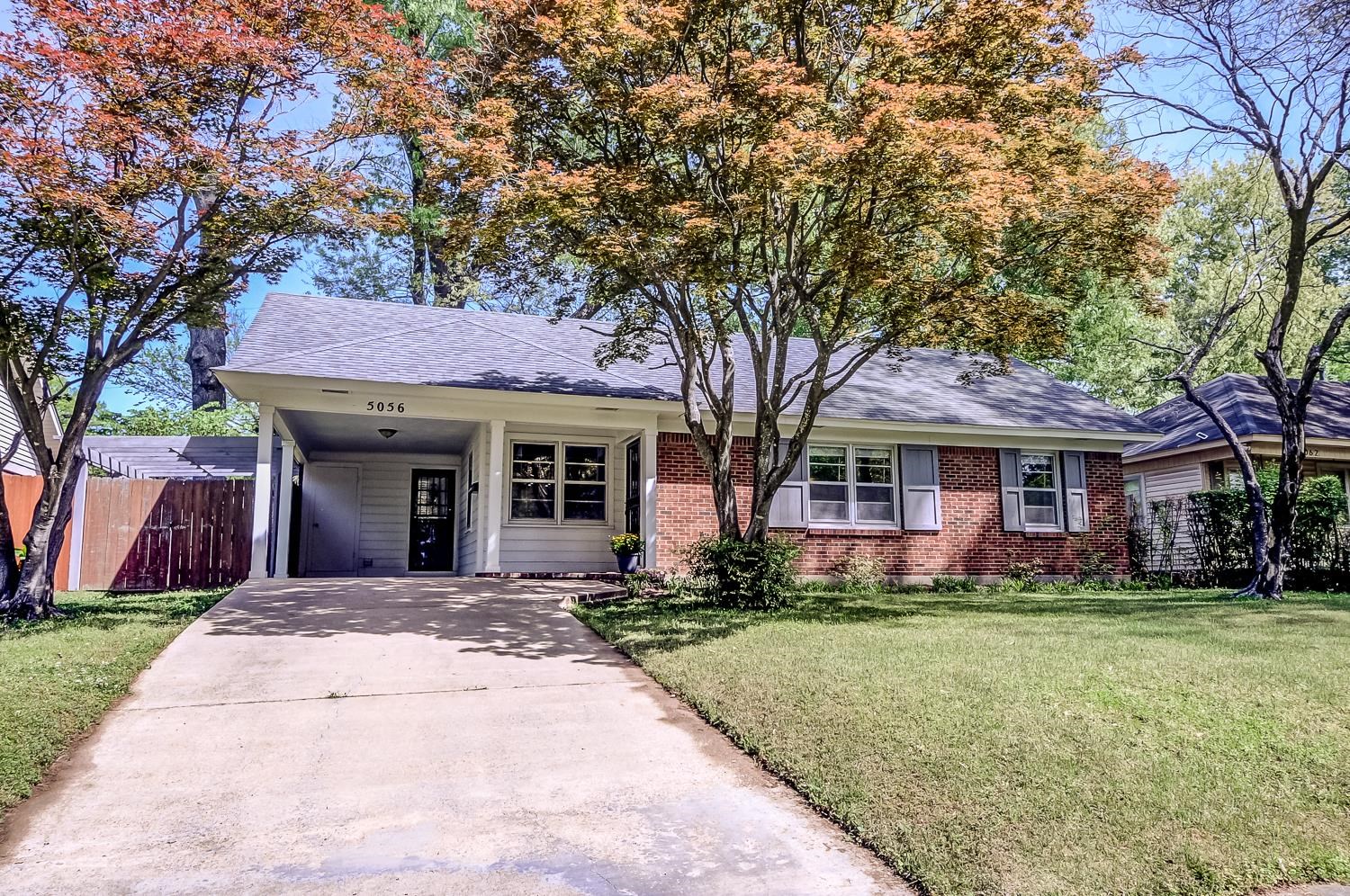 5056 Wingdale Road Memphis, TN 38117 - Photo 18 of 18 Ranch-style home with a carport, concrete driveway, brick siding, and roof with shingles