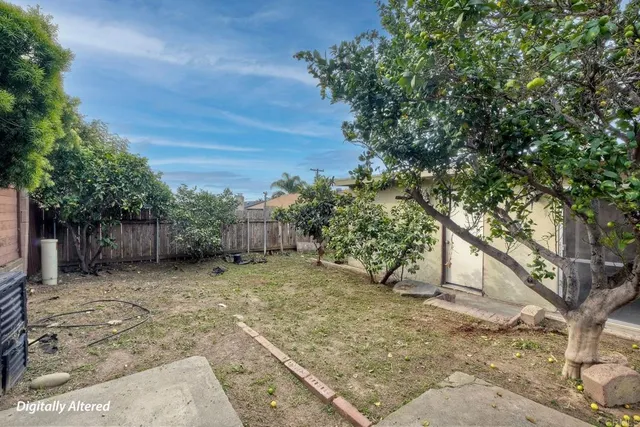 a backyard of a house with lots of trees