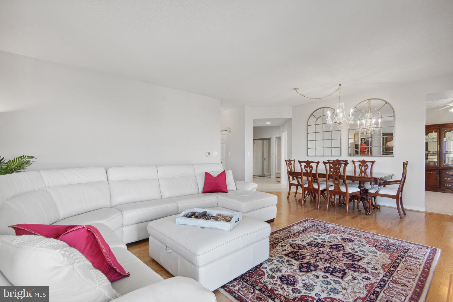 19375 Cypress Ridge Terrace, Unit 607 Leesburg, VA 20176 - Photo 12 of 30 Living room with sectional sofa, view to dining rm