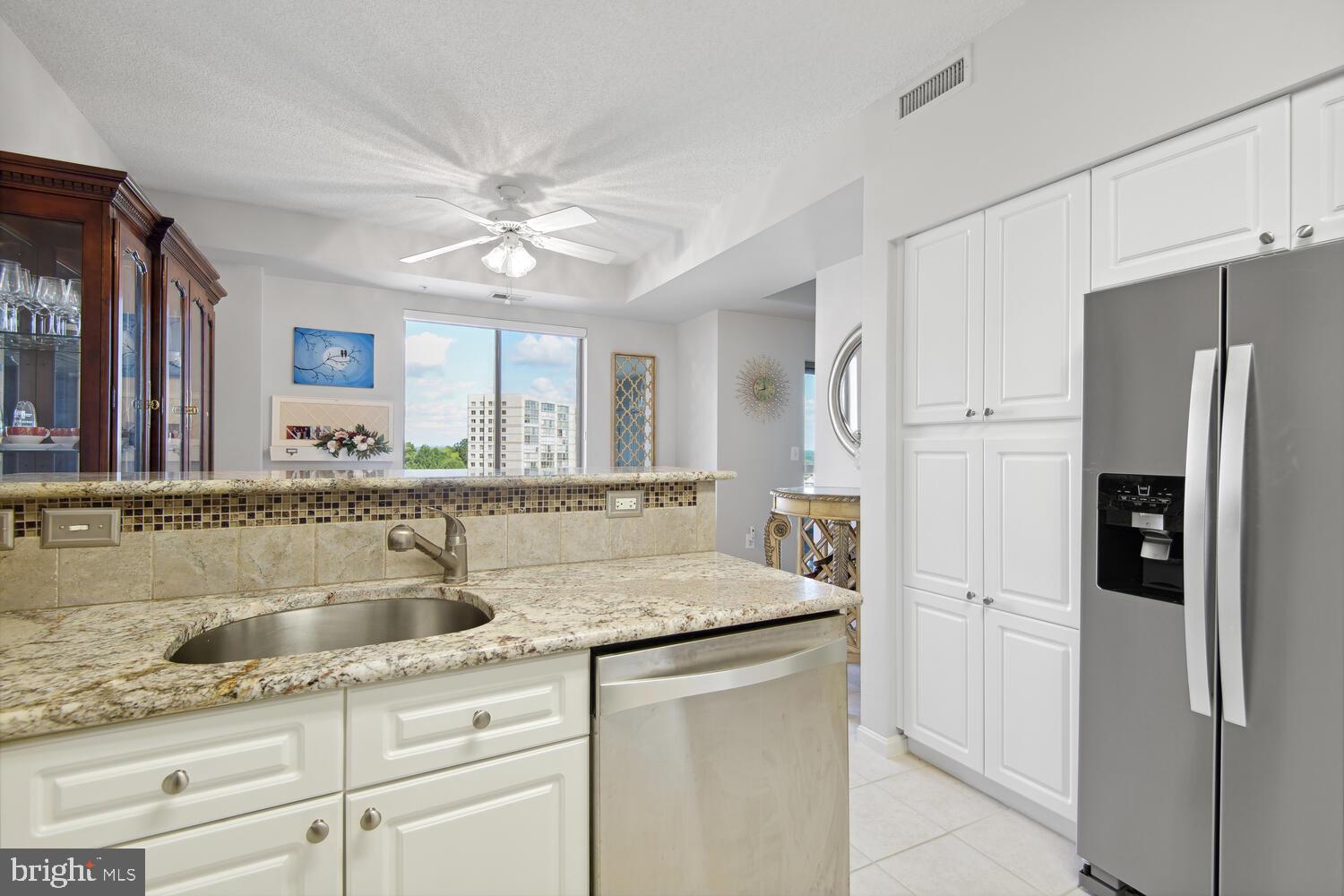19375 Cypress Ridge Terrace, Unit 607 Leesburg, VA 20176 - Photo 16 of 30 Note the granite countertops and stainless sink