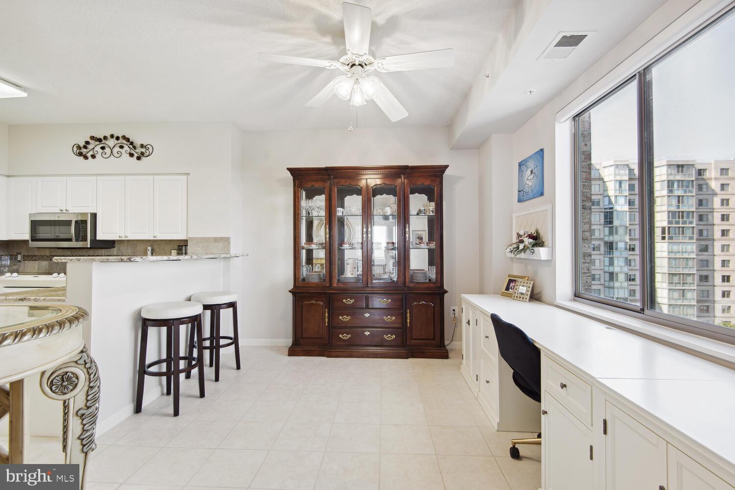 19375 Cypress Ridge Terrace, Unit 607 Leesburg, VA 20176 - Photo 17 of 30 Kitchen table space, with bar stool seating too