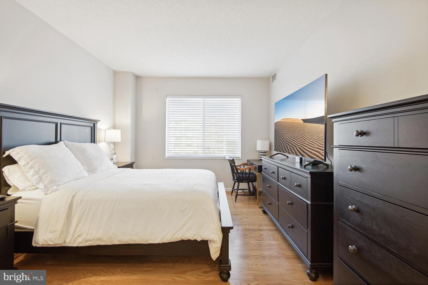 19375 Cypress Ridge Terrace, Unit 607 Leesburg, VA 20176 - Photo 20 of 30 Spacious primary BR, Note the wood floors.