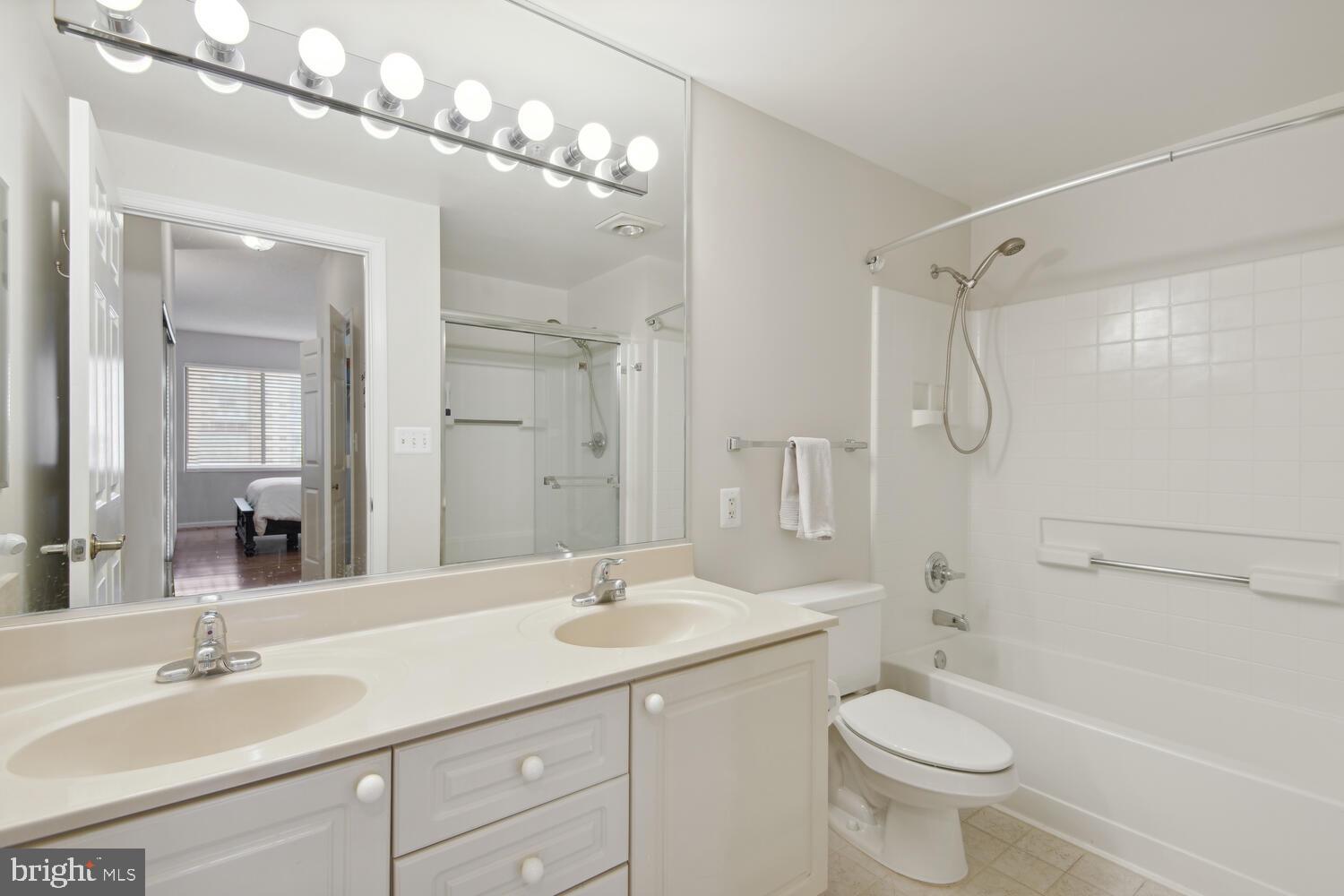 19375 Cypress Ridge Terrace, Unit 607 Leesburg, VA 20176 - Photo 23 of 30 Primary bath, double sinks, separate tub & shower