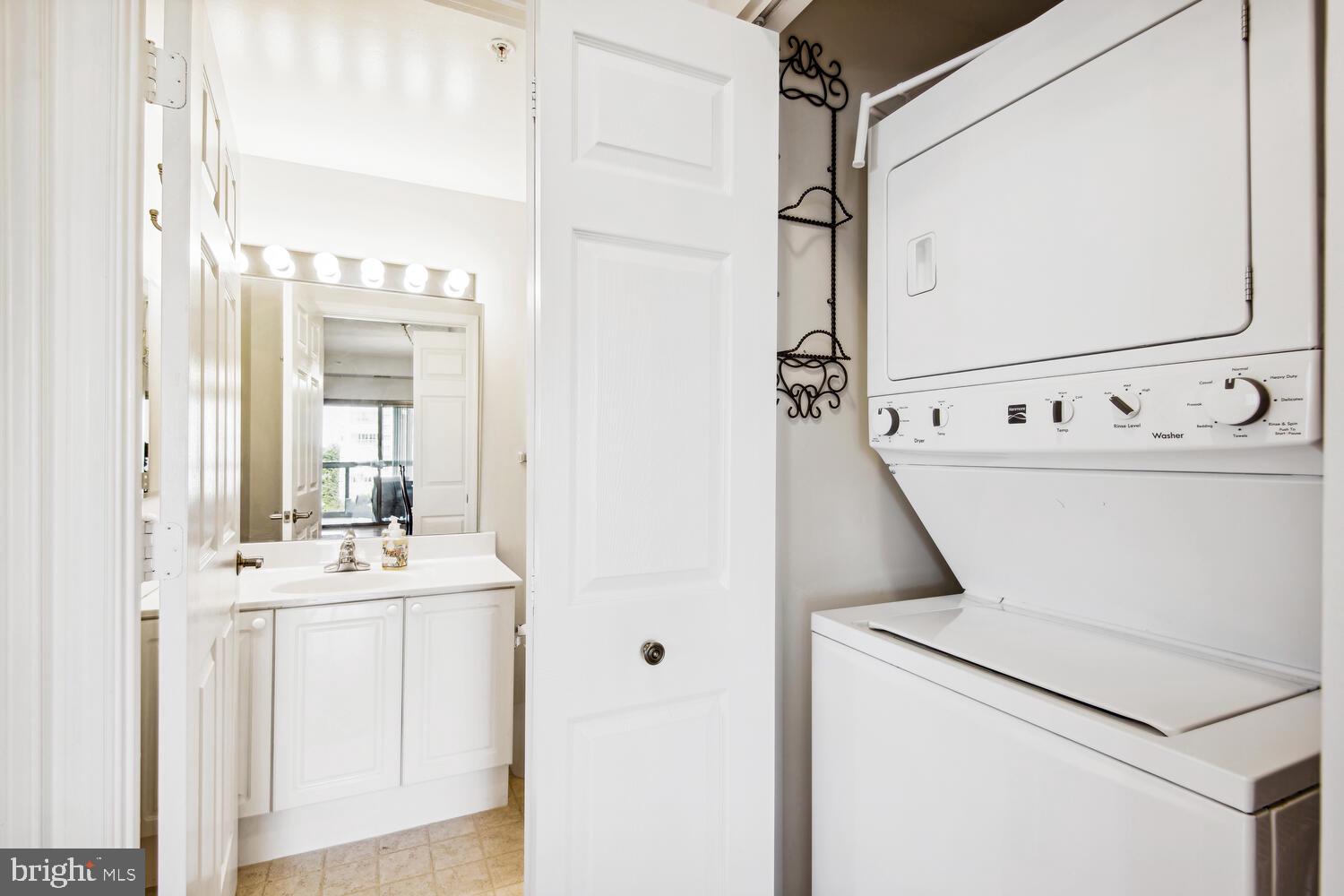 19375 Cypress Ridge Terrace, Unit 607 Leesburg, VA 20176 - Photo 27 of 30 Washer and dryer near the guest bath.