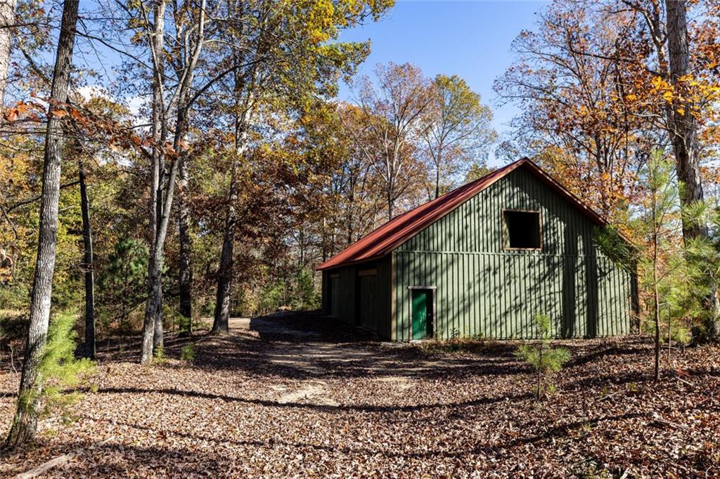 400 Kitchens Mountain Road Northwest Cartersville, GA 30120 - Photo 5 of 32 a view of a house with a yard