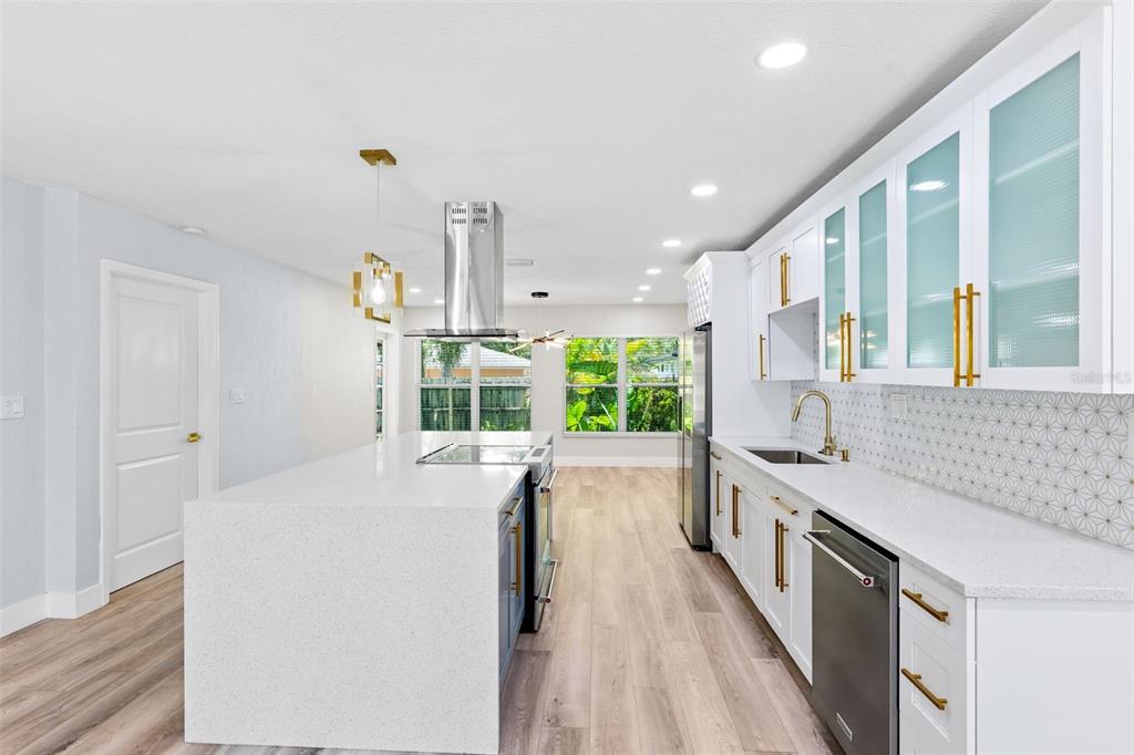 8231 31st Terrace North St. Petersburg, FL 33710 - Photo 14 of 55 a large white kitchen with a large window