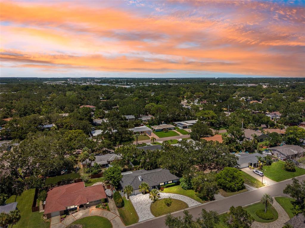 8231 31st Terrace North St. Petersburg, FL 33710 - Photo 15 of 55 an aerial view of residential houses with outdoor space and trees