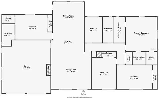 an empty room with windows and fireplace