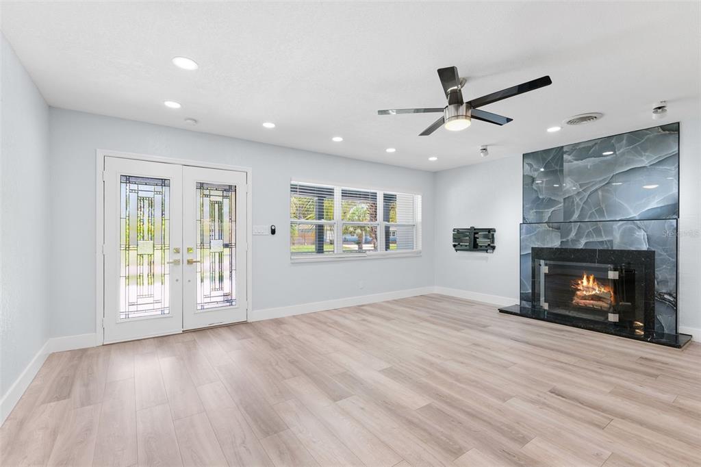 8231 31st Terrace North St. Petersburg, FL 33710 - Photo 19 of 55 an empty room with windows and fireplace
