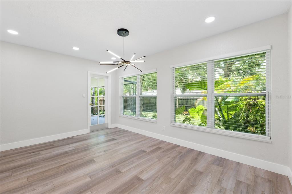 8231 31st Terrace North St. Petersburg, FL 33710 - Photo 21 of 55 a view of an empty room with wooden floor and a window
