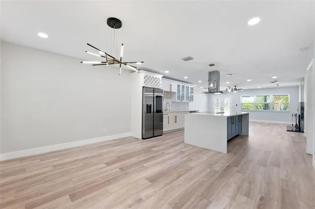 a view of room with window and ceiling fan
