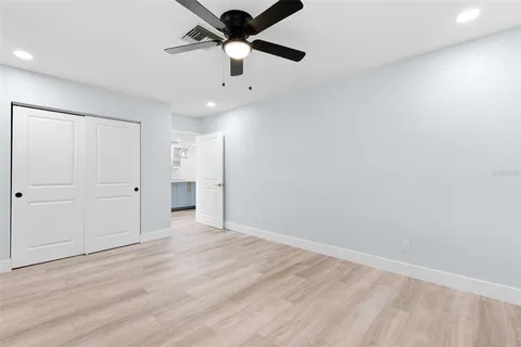 a bathroom with a sink mirror and vanity