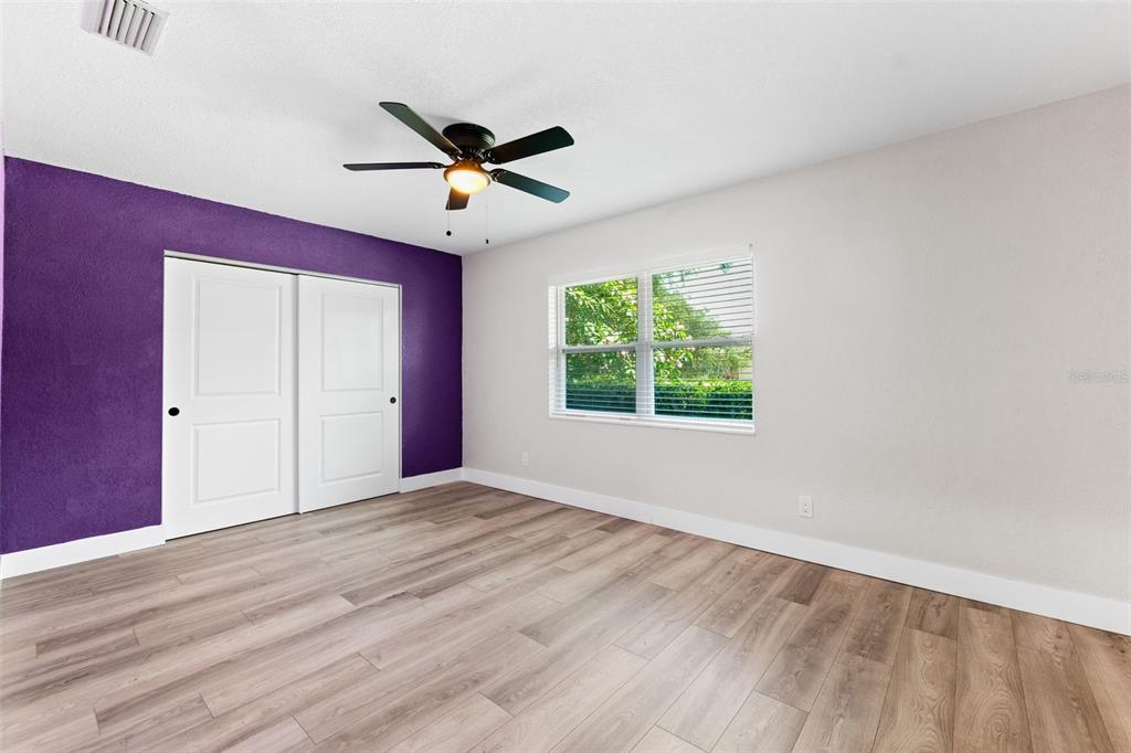 8231 31st Terrace North St. Petersburg, FL 33710 - Photo 36 of 55 a view of empty room with wooden floor and fan