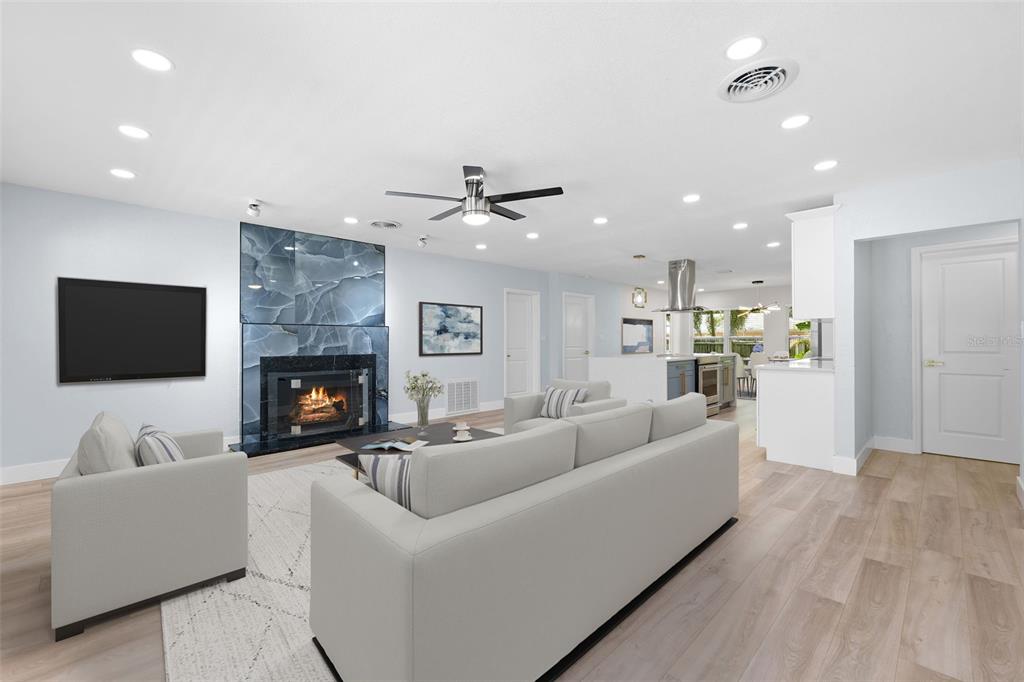 8231 31st Terrace North St. Petersburg, FL 33710 - Photo 4 of 55 a living room with furniture and a flat screen tv