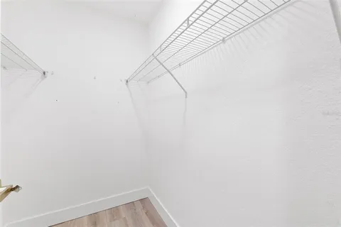 a view of a room that has a window