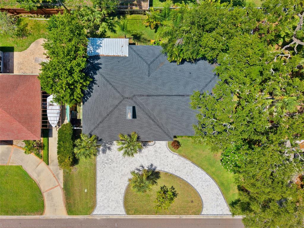 8231 31st Terrace North St. Petersburg, FL 33710 - Photo 52 of 55 an aerial view of a house with a garden and trees