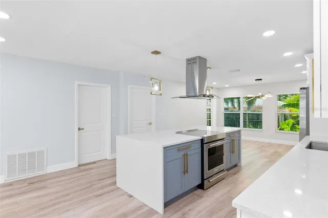 a kitchen with a stove and a sink