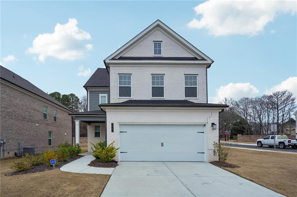 2101 Ecoland Drive Grayson, GA 30017 - Photo 1 of 26 a front view of a house with garage