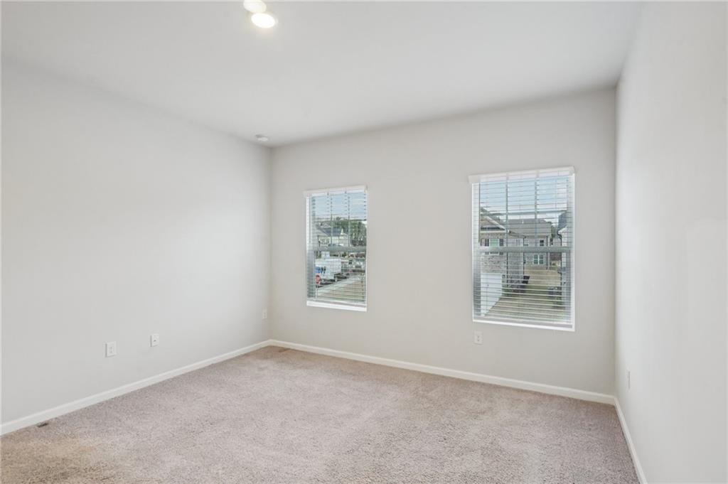 2101 Ecoland Drive Grayson, GA 30017 - Photo 17 of 26 an empty room with windows