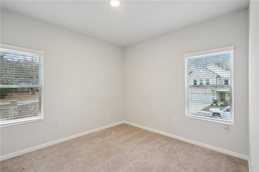2101 Ecoland Drive Grayson, GA 30017 - Photo 19 of 26 an empty room with windows