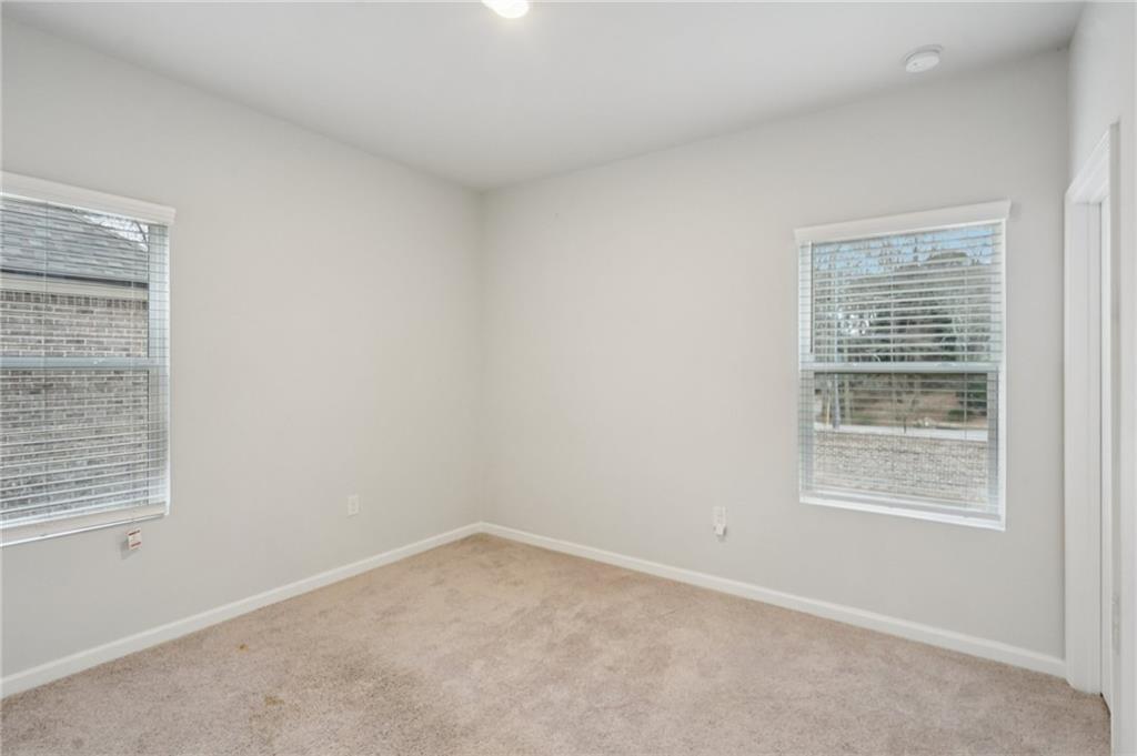 2101 Ecoland Drive Grayson, GA 30017 - Photo 21 of 26 an empty room with a window