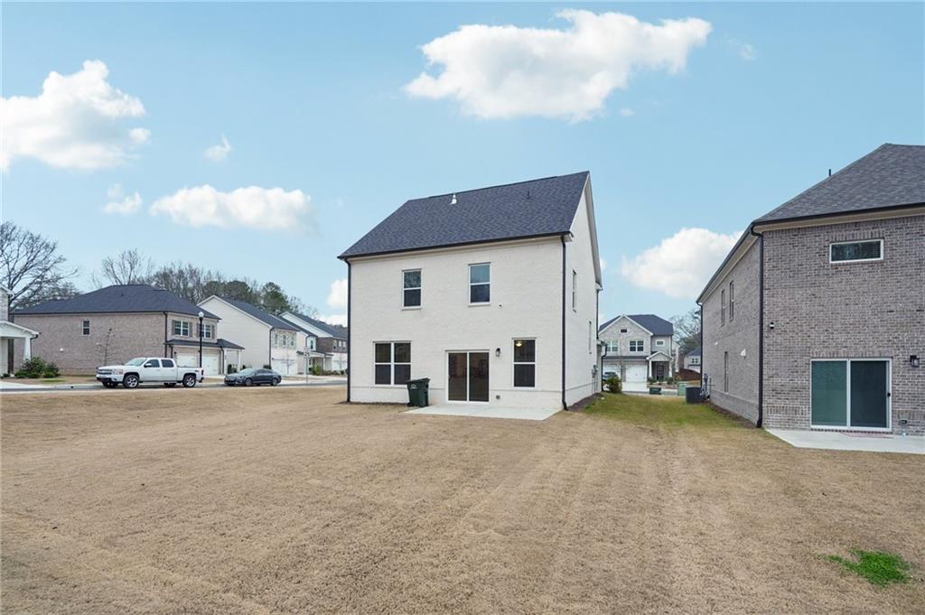 2101 Ecoland Drive Grayson, GA 30017 - Photo 25 of 26 a view of a house with a big yard and large trees