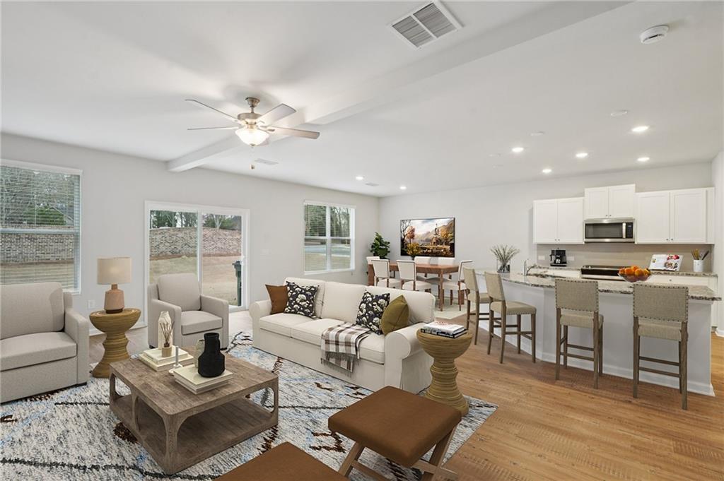 2101 Ecoland Drive Grayson, GA 30017 - Photo 5 of 26 a living room with furniture kitchen view and a window