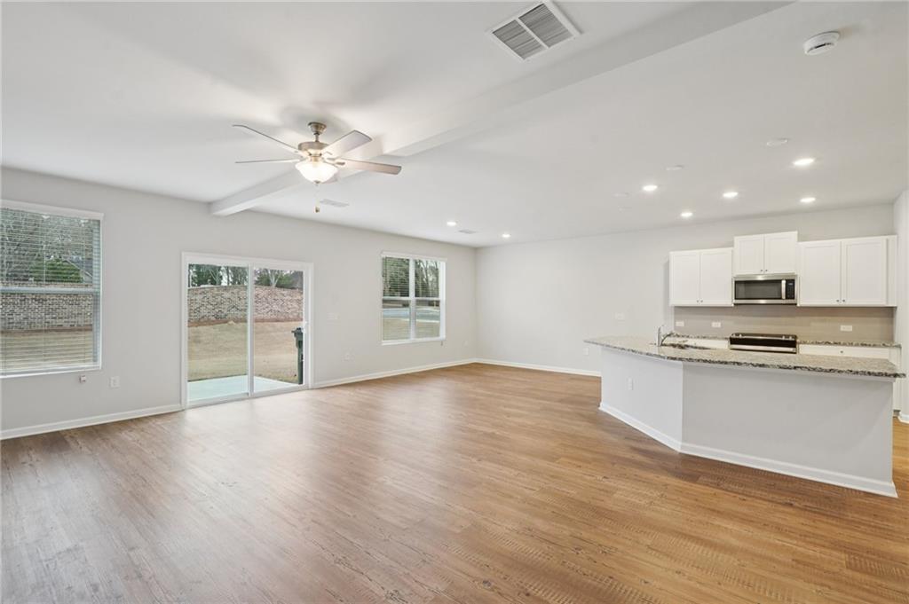 2101 Ecoland Drive Grayson, GA 30017 - Photo 6 of 26 a view of kitchen with sink microwave and stove