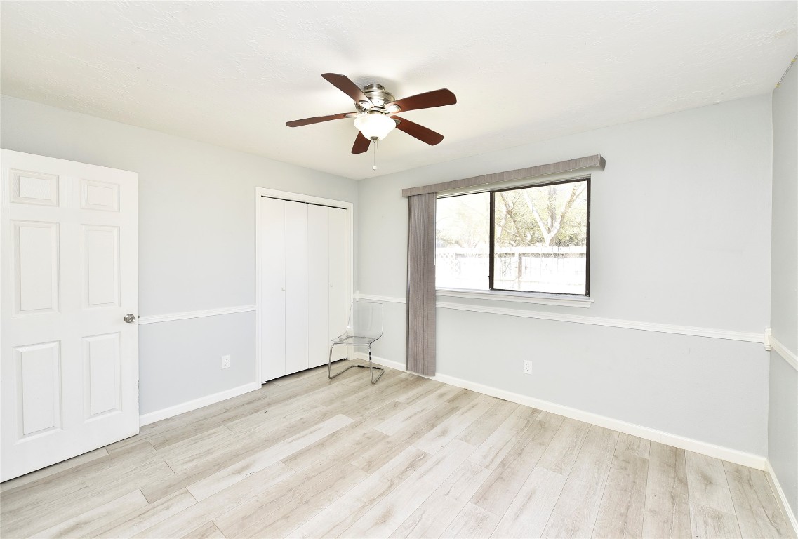 3203 East Rangecrest Place Sugar Land, TX 77479 - Photo 19 of 36 a view of empty room with wooden floor and fan