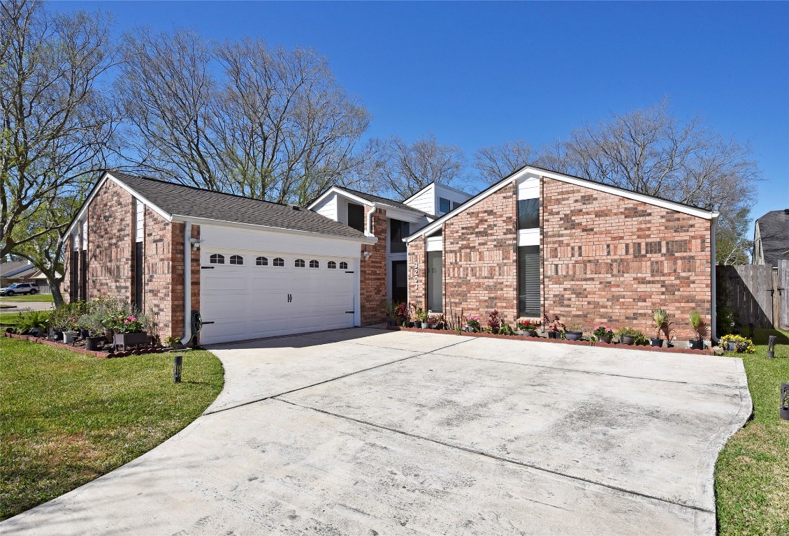 3203 East Rangecrest Place Sugar Land, TX 77479 - Photo 2 of 36 a view of an building with a garden